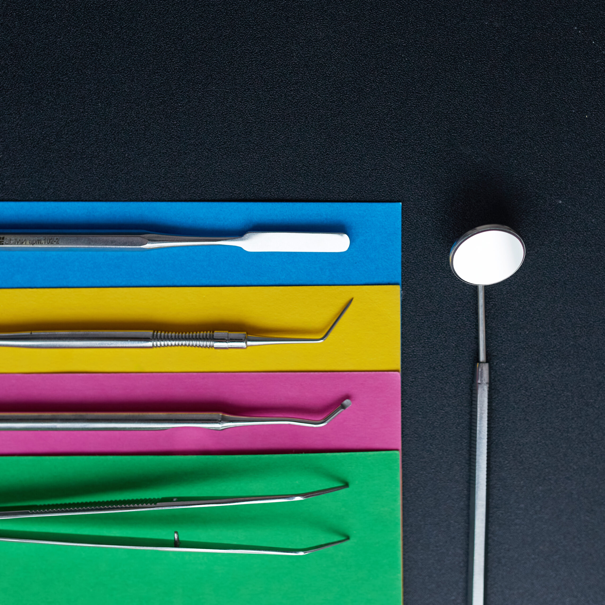 Dental instruments on a colorful background